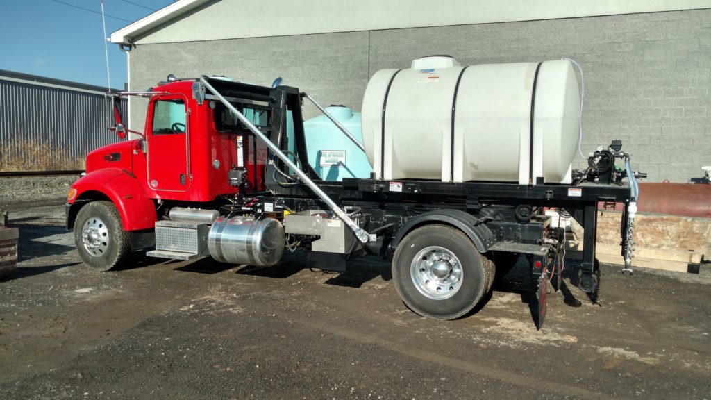1065 gallon tank brine spraying system