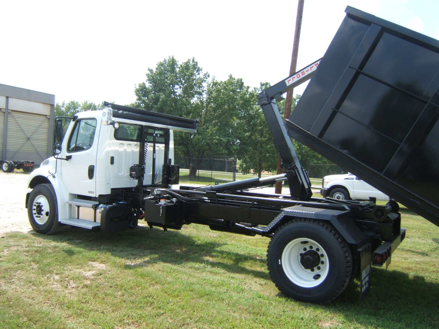 Ampliroll Hooklift Featured Dealer QUALITY TRUCK BODIES & REPAIR, ELM